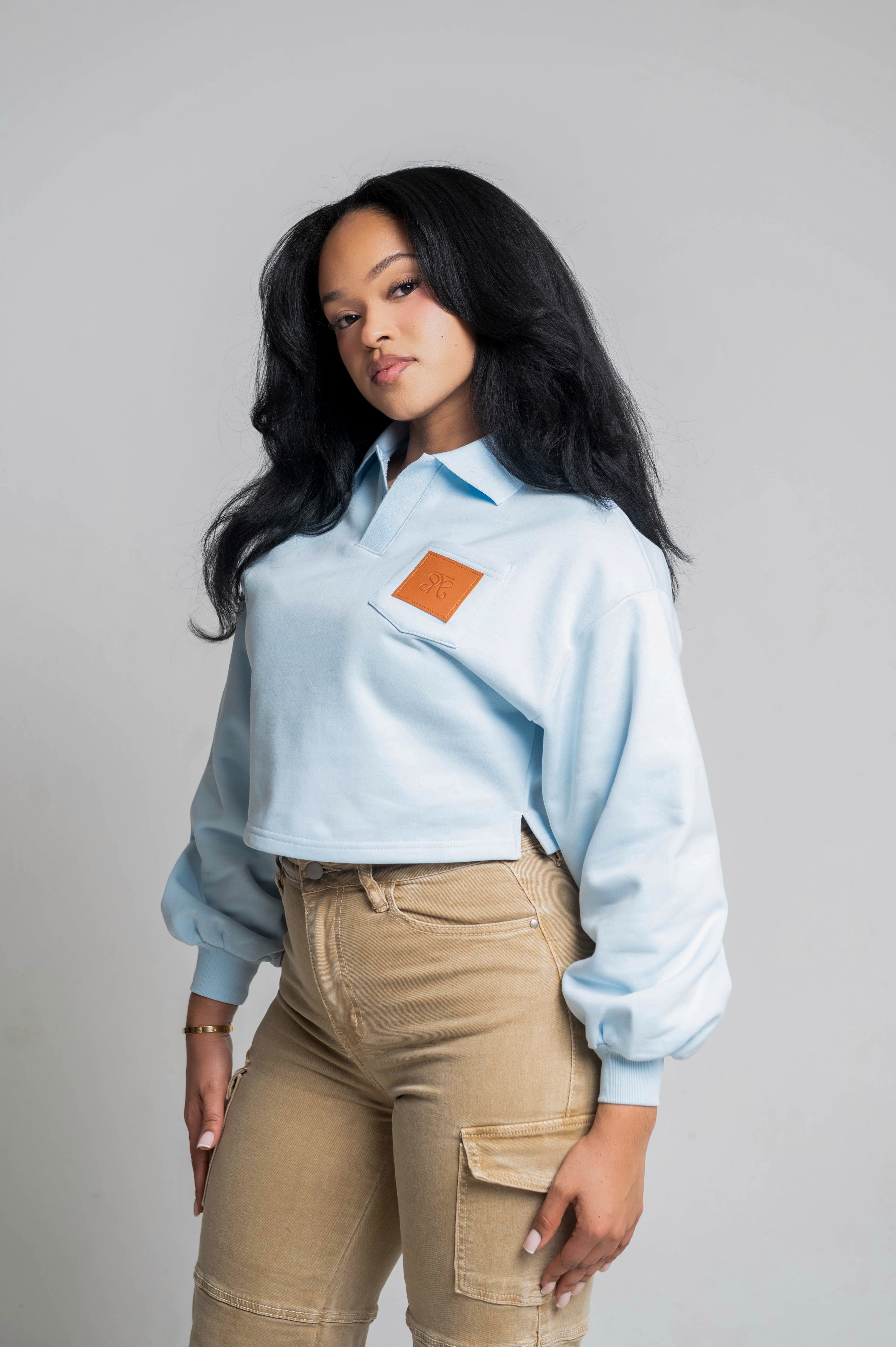 Baby Blue Cropped Sweatshirt with Leather Patch